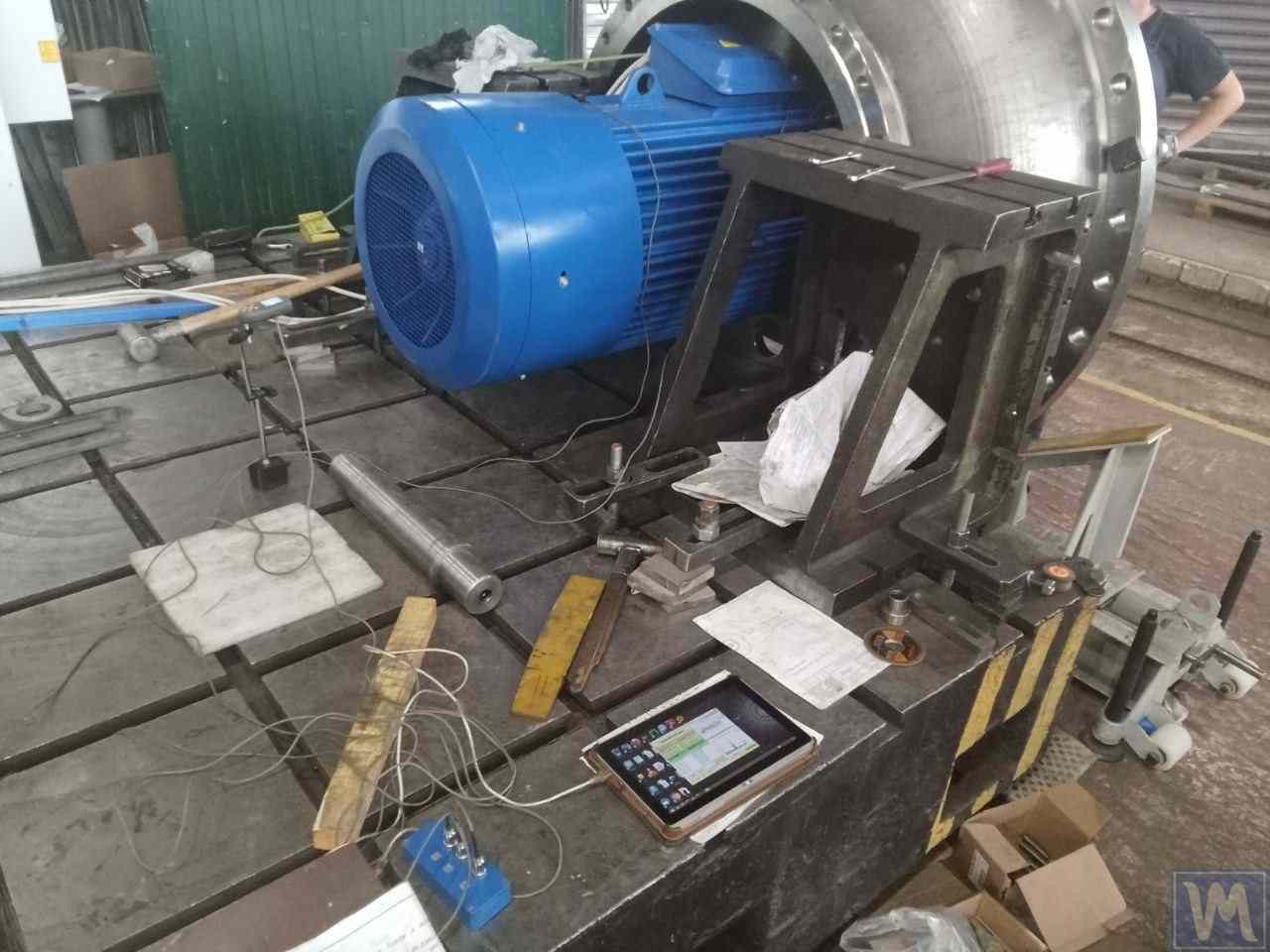 Balancing an industrial fan: vibration sensors fitted, laser tachometer, tablet running the diagnostic software