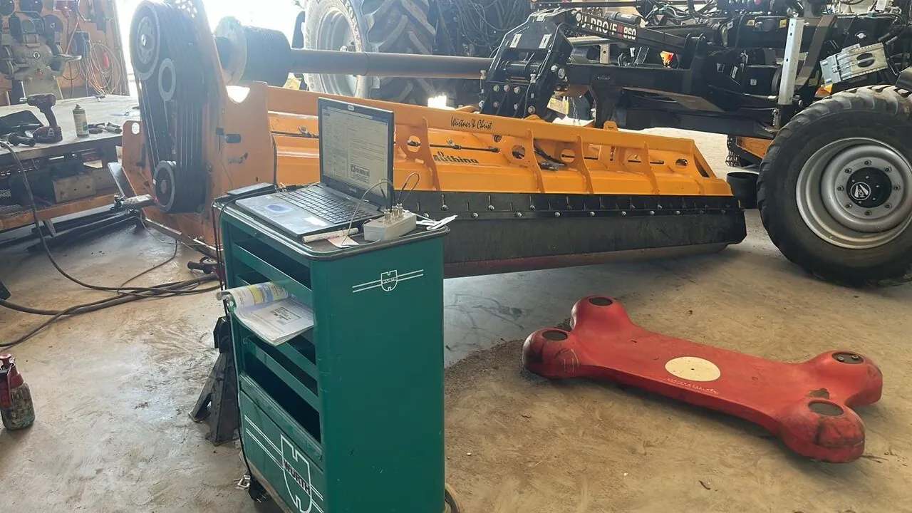 Balanset-1A balancing instrument in action during mulcher balancing